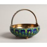 A 19TH CENTURY RUSSIAN SILVER AND ENAMEL CIRCULAR BASKET with swing handles on three ball feet