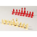 A RED & WHITE IVORY CHESS SET in an oak box along with a letter which states it belonged to the