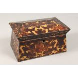 A FAUX TORTOISESHELL TWO DIVISION SARCOPHAGUS SHAPED TEA CADDY 9ins wide