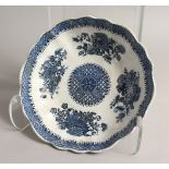 A BLUE AND WHITE SHAPED CIRCULAR DISH 9.5ins diameter Blue star mark.