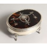 A GOOD OVAL SILVER AND TORTOISESHELL JEWLLLERY BOX on four curving legs. London 1908
