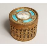 A FRENCH CIRCULAR GILDED METAL AND ENAMEL BOX with portrait of a young girl and mirror inside the