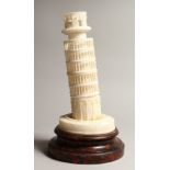 AN ALABASTER GROUP OF THE LEANING TOWER OF PISA , on a wooden base 13ins high.