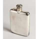 A SILVER HIP FLASK with hinged, captive top Sheffield 1941 5ozs, 5ins high.