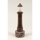 A CORNISH SERPENTINE MARBLE LIGHTHOUSE 10ins high.