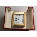 A VERY GOOD CARTIER PARIS TRAVELLING CLOCK in a red Cartier case, No. 750503920.