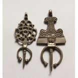 TWO SMALL ISLAMIC SILVER HEAD PIECES.