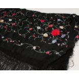 AN EMBROIDERED SHAWL