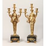 A PAIR OF GILT, BRONZE AND MARBLE THREE LIGHT FIGURAL CANDELABRAS, in the manner of Thomas Hope.