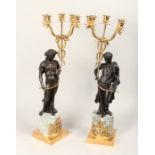 AN IMPRESSIVE PAIR OF CLASSICAL BRONZE, GILT BRONZE AND MARBLE FIVE LIGHT CANDELABRA, modelled as