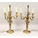 A GOOD PAIR OF FRENCH BRONZE THREE BRANCH CANDELABRA with scrolling arms and porcelain flowers 25ins