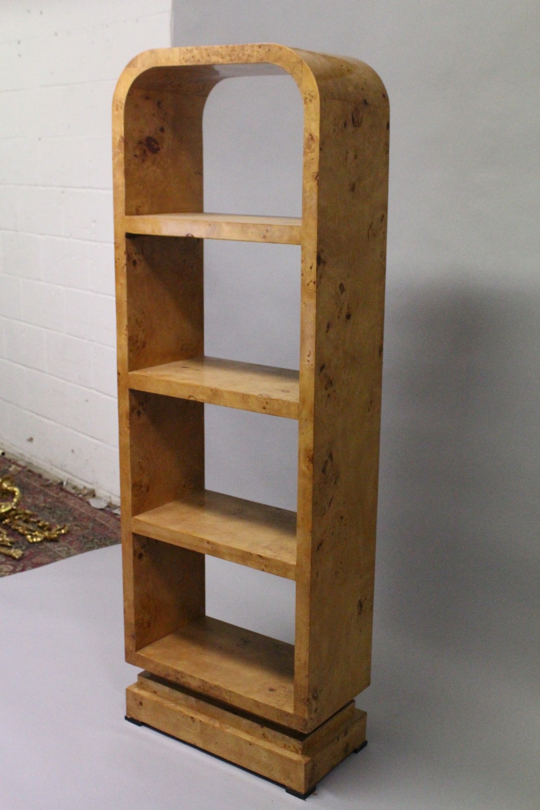 AN ART DECO STYLE BURR WOOD FREE STANDING OPEN BOOKSHELF, with four shelves on a platform base. - Image 3 of 3