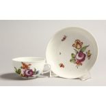 A 19TH CENTURY VIENNA COFFEE CUP AND SAUCER painted with flowers. Mark in blue