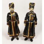 A LARGE PAIR OF COLD PAINTED BRONZE FIGURES OF RUSSIAN COSSACKS. 1ft 4ins high