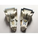 A PAIR OF MAJOLICA BRACKETS with painted decoration. 9ins long