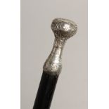 A WALKING CANE with SILVER HANDLE Engraved `POUR COMBLE DE BONHERT' 31ins long