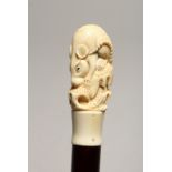A NOVELTY WALKING STICK, with carved bone handle modelled as a rat. 36ins high.