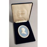 A WEDGWOOD BLUE AND WHITE OVAL PLAQUE " H.R.H. THE DUKE OF EDINBURGH", in box.
