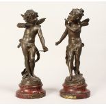 A PAIR OF 19TH CENTURY FRENCH BRONZES, CUPID AND PSYCHE on a circular base "AMOR CONBOTTANT" Par Aug