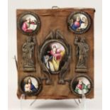 FIVE VARIOUS ENAMEL RELIGIOUS PORTRAITS with metal figures in a wooden tablet 12ins x 10ins