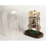 A VERY GOOD BRASS SKELETON CLOCK CATHEDRAL SHAPED, striking on a single bell with glass dome.