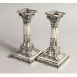 A PAIR OF CLASSICAL SILVER CANDLESTICKS Sheffield 1902 Maker James Dixon & sons.