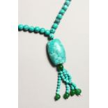 A TURQUOISE BEAD NECKLACE.