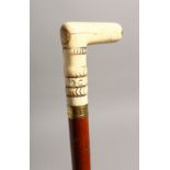 A 19TH CENTURY WALKING STICK with bone handle 31ins long