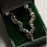 A PAIR OF SILVERR EMERALD SNAKE EAR RINGS