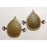 A PAIR OF 19TH CENTURY ISLAMIC GILT METAL OPENWORK CALLIGRAPHIC PANELS, inlaid with turquoise and