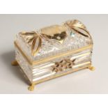 A CUT GLASS AND GILDED DOMED TOP JEWEL CASKET on claw feet. 7ins high.
