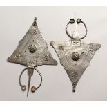 A PAIR OF ISLAMIC SILVER HEAD PIECES