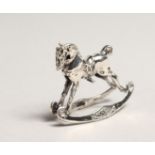 A SILVER ROCKING HORSE