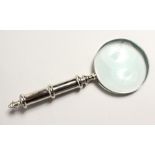 A MAGNIFYING GLASS with chrome handle
