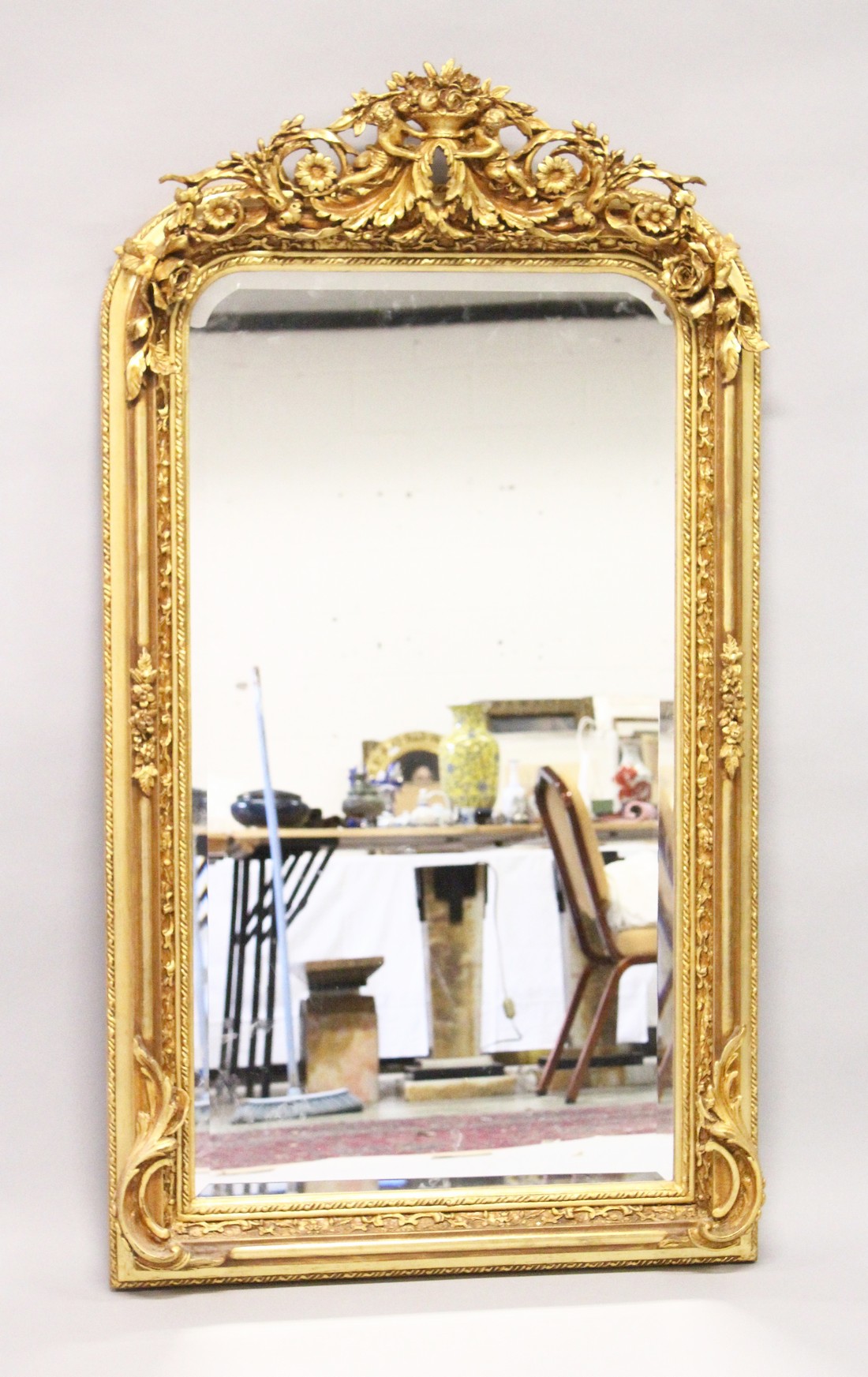 A LARGE ORNATE GILT FRAMED ARCH TOP MIRROR, the top with cherubs holding a basket of flowers 5ft - Image 2 of 5