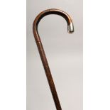 A WALKING STICK with silver handle London 1916, 36ins long