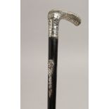 A WALKING CANE with .800silver handle encscribed "PREIS HUBERTIS". 33ins long