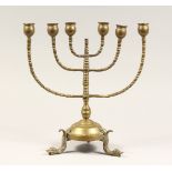 AN ANTIQUE JEWISH BRASS MENORAH 13ins high