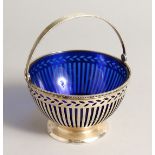 A TIFFANY & CO. PIERCED SILVER SUGAR BOWL with sapphire blue liner