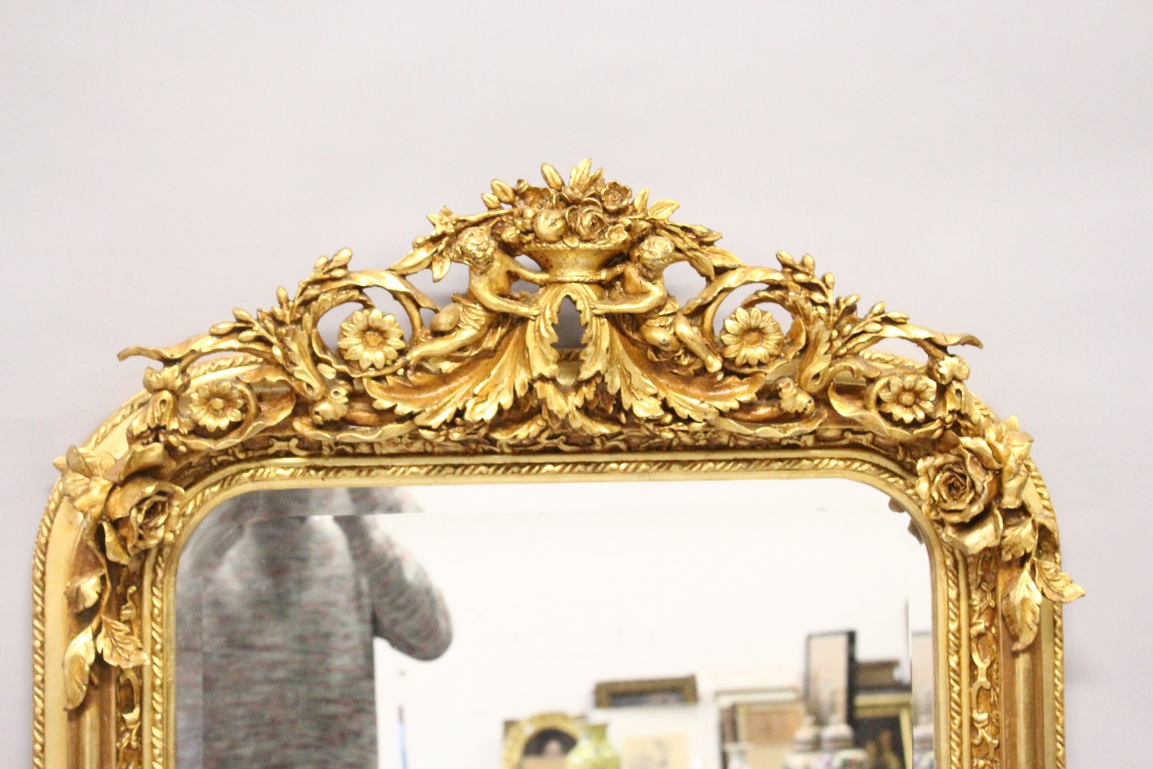 A LARGE ORNATE GILT FRAMED ARCH TOP MIRROR, the top with cherubs holding a basket of flowers 5ft - Image 3 of 5