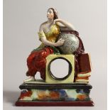 A PRATTWARE CLOCK CASE, a classical female seated beside a globe. 9ins high.