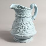 A RIDGWAY TURQUOISE POTTERY JUG with figures in relief. 11ins high