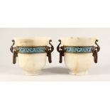 A VERY GOOD PAIR OF 19TH CENTURY FRENCH ONYX URNS with ormolu handles and champleve enamel band 2ins