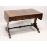 A GOOD REGENCY ROSEWOOD SOFA TABLE, with folding flaps, two single drawers with replacement wooden