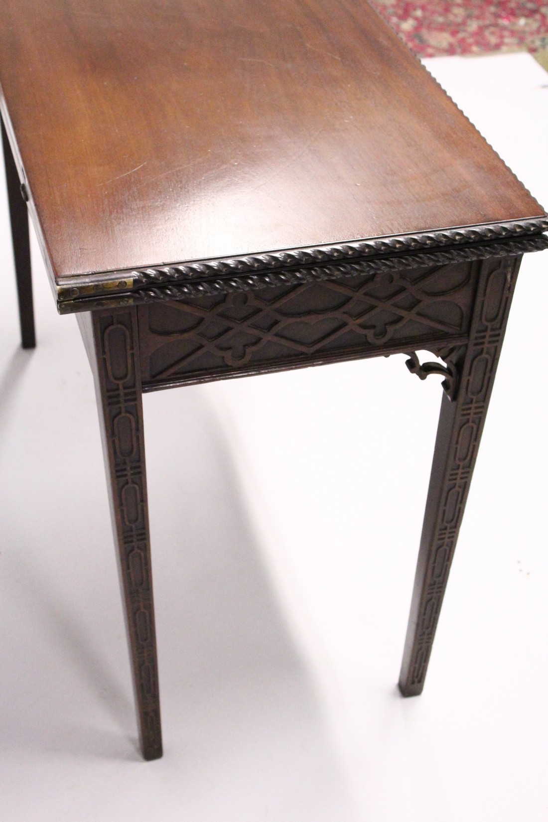 A GOOD GEORGE III MAHOGANY RECTANGULAR FOLDING TOP TEA TABLE with blind fret, curving and single - Image 7 of 7