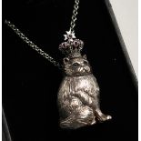 A SILVER ROYAL CAT, WITH CROWN, PENDANT on a chain