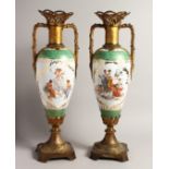 A TALL PAIR OF 19TH CENTURY CONTINENTAL PORCELAIN TWO HANDLED SLENDER VASES with reverse scenes of