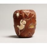 A JAPANESE WOOD AND BONE DRUM BOX with fruit and monkeys. 3ins high.