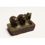 A GOOD JAPANESE BRONZE THREE PIGS AT A TROUGH 2ins