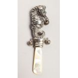 A BABY'S SEA HORSE AND MOTHER OF PEARL RATTLE